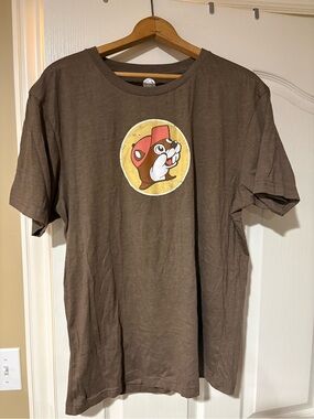 NWOT - Buc-ee’s- Brown Graphic Tee with Retro Mascot Patch